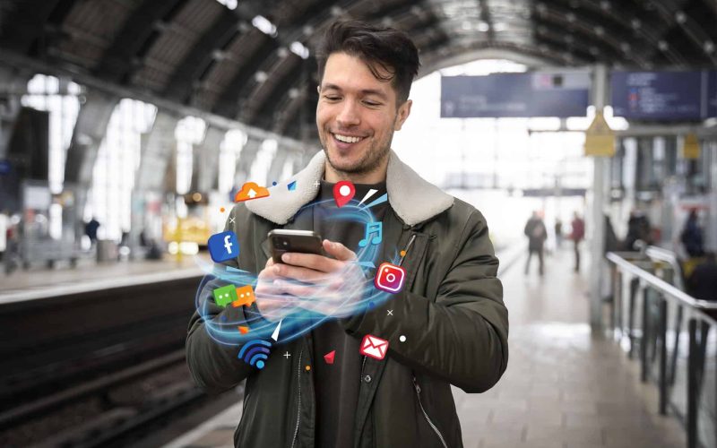 medium-shot-man-holding-smartphone (1)